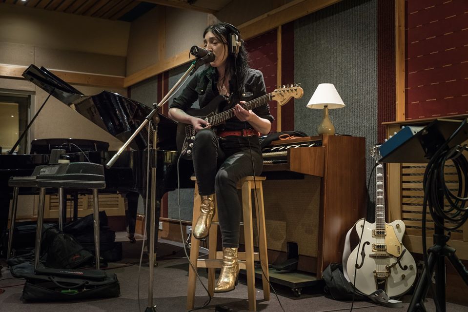 Emily at Rockfield Studios playing guitar and singing