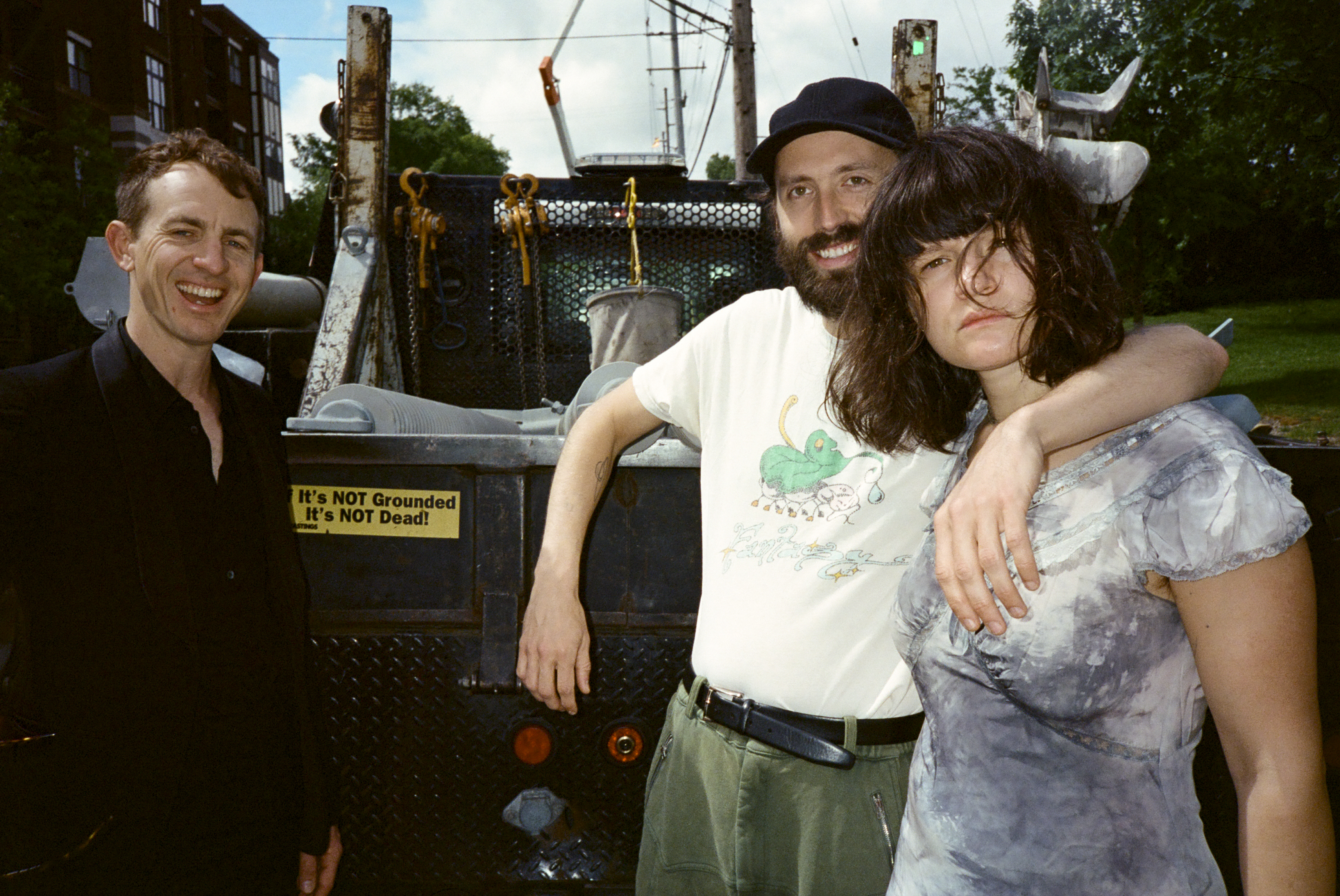 Big Thief band pictured by the back of a pick up truck