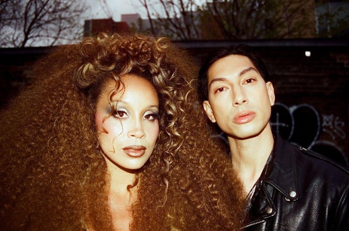 A portrait of two-piece LION BABE.