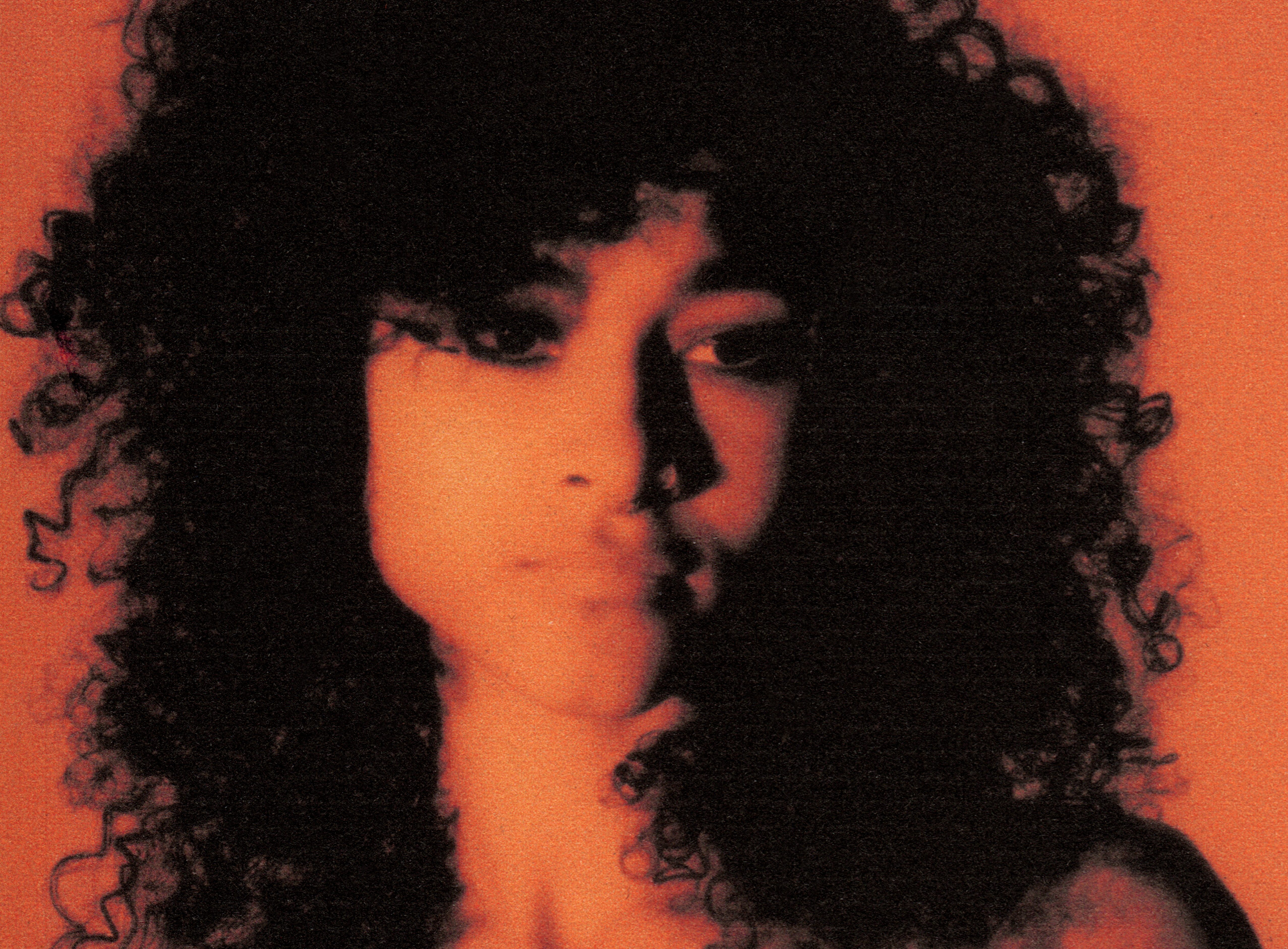 Orange and black tinted portrait of UCHE YARA
